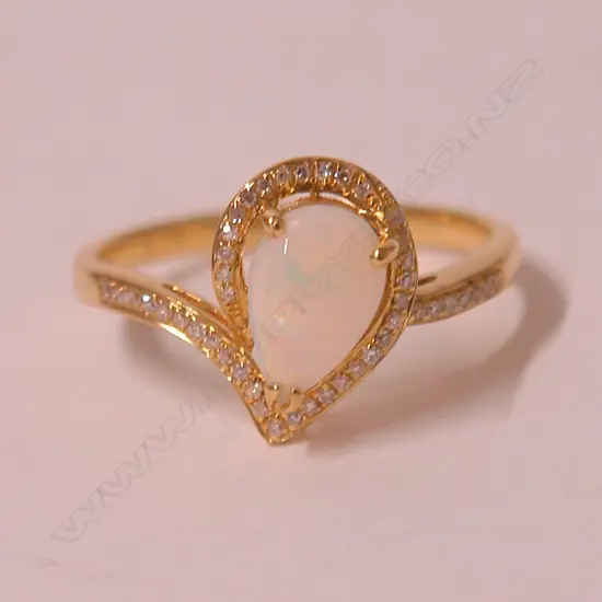 An 18ct. yellow gold opal and diamond lady's dress ring