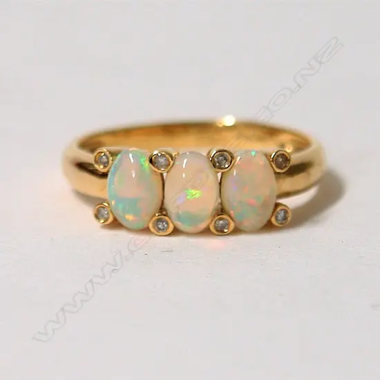 An 18ct. yellow gold opal and diamond modern dress ring