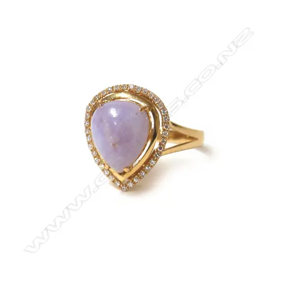 An 18ct. yellow gold purple jade and diamond lady's dress ring
