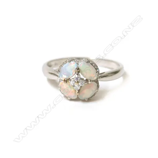 An 18ct. white gold opal and diamond lady's dress ring