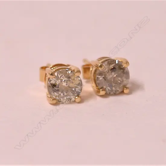 A pair of approx. 0.80ct. solitaire brilliant cut diamond earrings