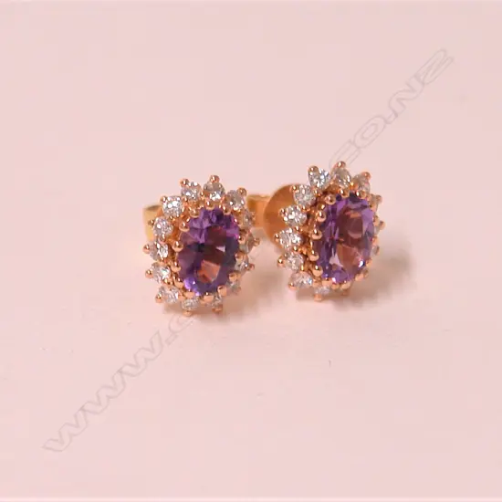 A pair of modern 18ct. rose gold amethyst and diamond earrings