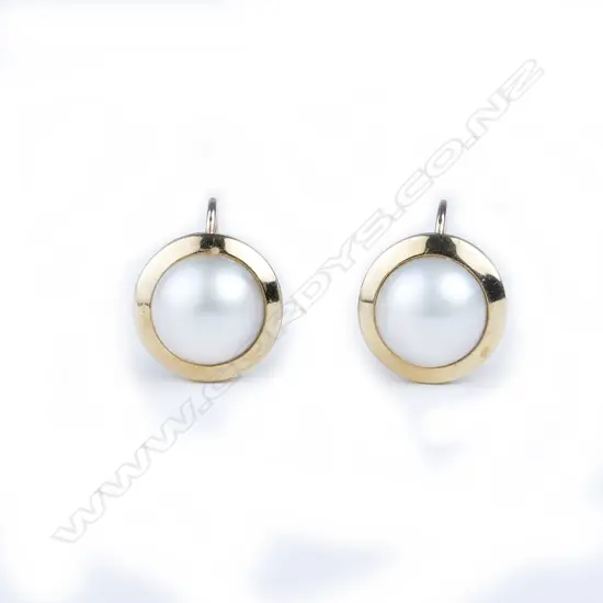 A pair of 9ct. gold and mabe pearl earrings