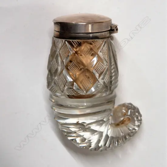 A George IV silver topped cut crystal ram's horn shaped snuff mull