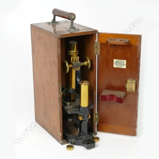 A Victorian brass and ebonised metal monocular microscope