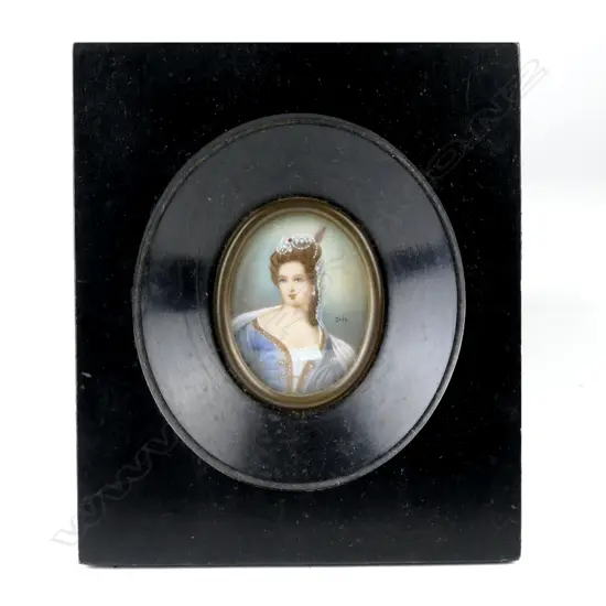 An oval painted miniature of an elegant woman