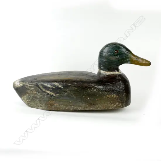 A hand carved balsa drake duck decoy