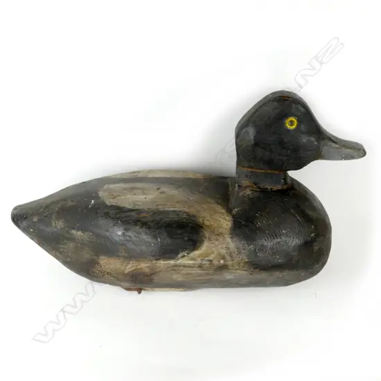 An early vintage handmade wooden blue bill duck decoy