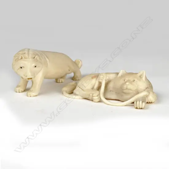 Two small carved ivory animals