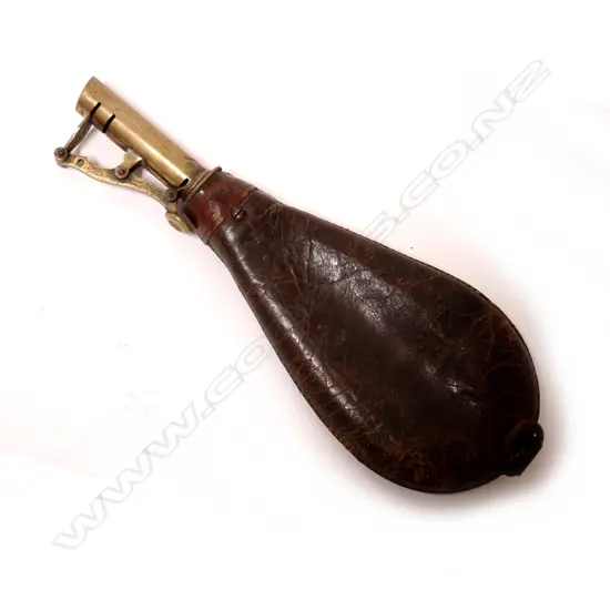 A Victorian brass and leather powder flask