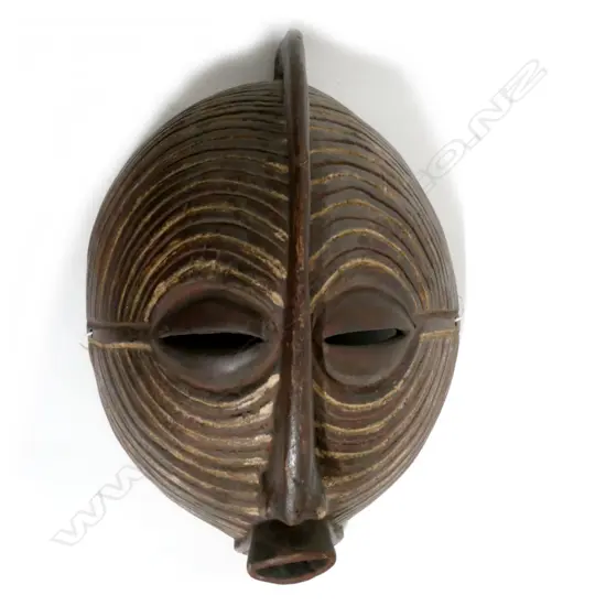 A wooden African face mask