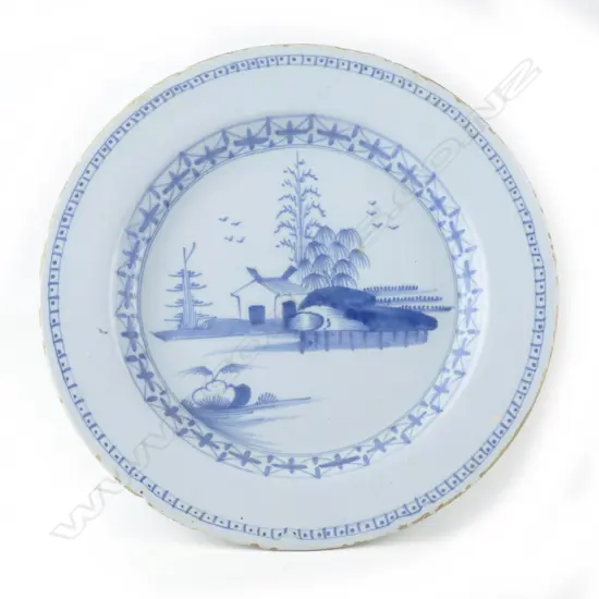 An 18thC Dutch Delft blue and white circular plate