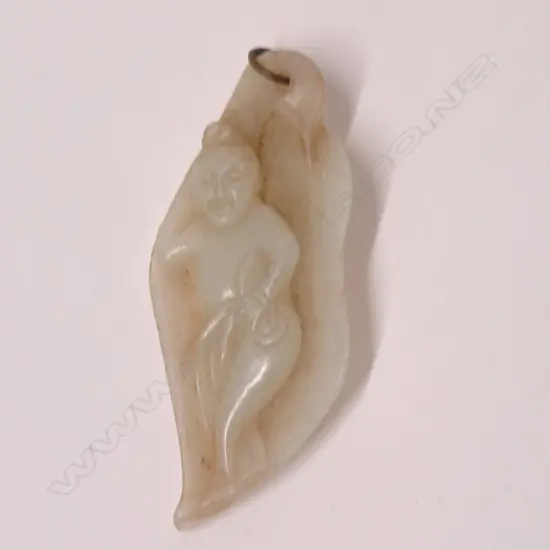 An old Chinese carved pale jade handling piece/pendant