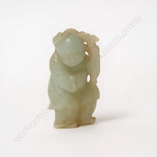 An old Chinese carved pale jade small figure