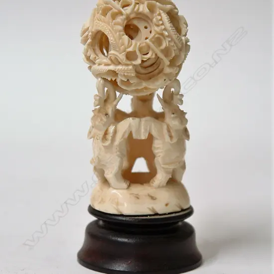 A vintage Chinese carved ivory puzzle ball on stand