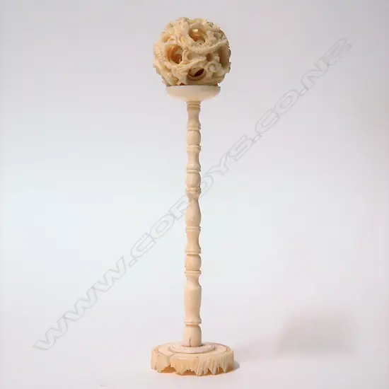 A vintage Chinese carved ivory small puzzle ball on stand