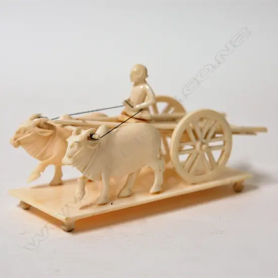 A vintage carved ivory group of a simple double ox-drawn cart