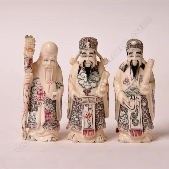 Three small Chinese gods represented as the gods of fortune