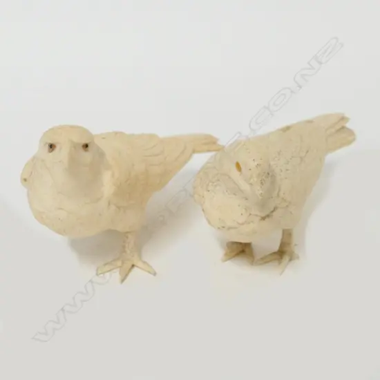 Two Japanese carved ivory studies of birds