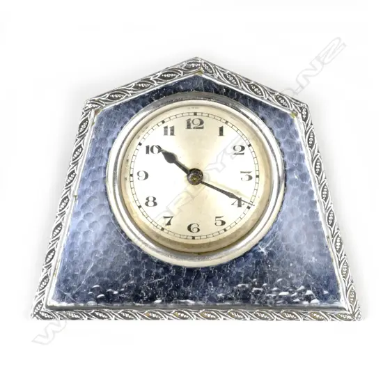 A small Tudric silver plate cased mantel clock