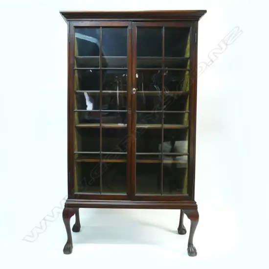 A Victorian tall bookcase cabinet with two glazed panelled doors