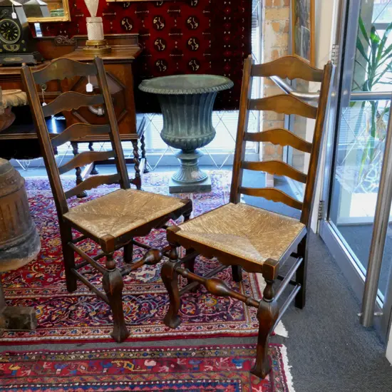 A pair of vintage beech Georgian style Lancashire ladder-back single chairs