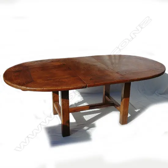 A vintage oak extension dining table