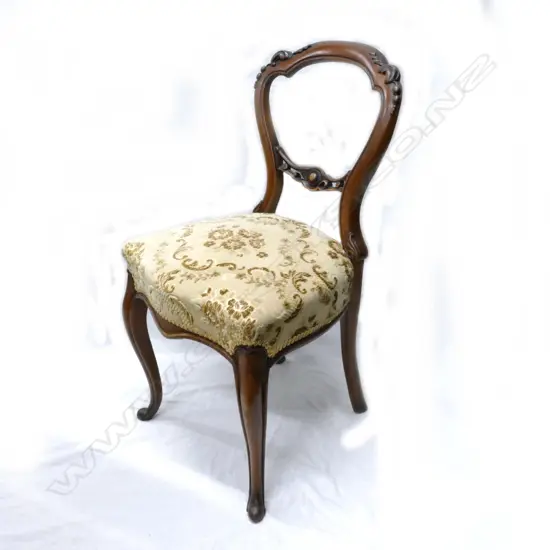 A set of six good Victorian walnut balloon-back dining chairs