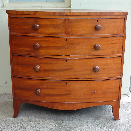 A late Georgian mahogany bowfront chest of five drawers