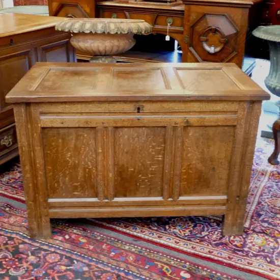 A Georgian oak three-panel coffer
