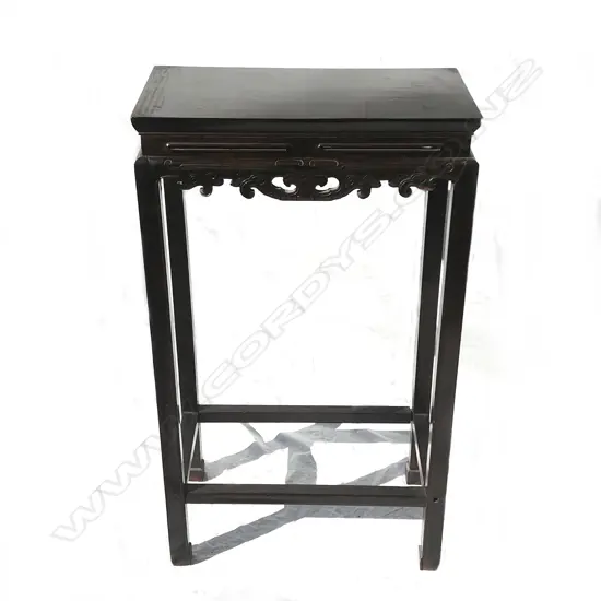 A tall old Chinese ebonised side table