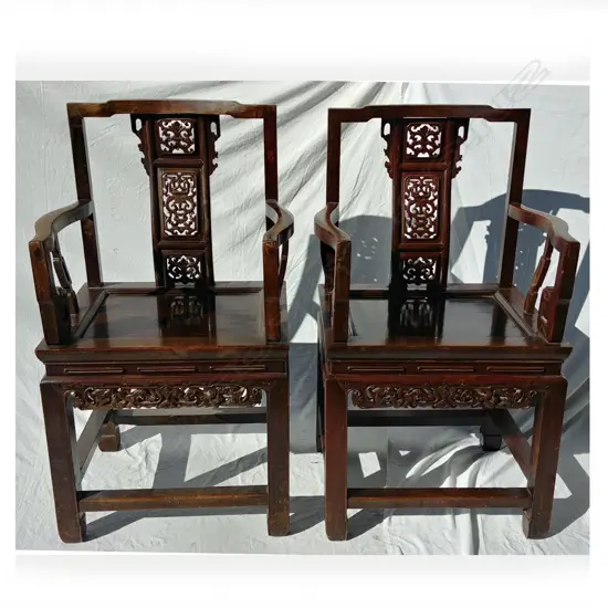 Four old Chinese dark hardwood open elbow chairs