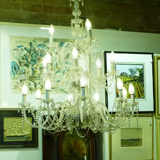 A large pressed glass three tier chandelier