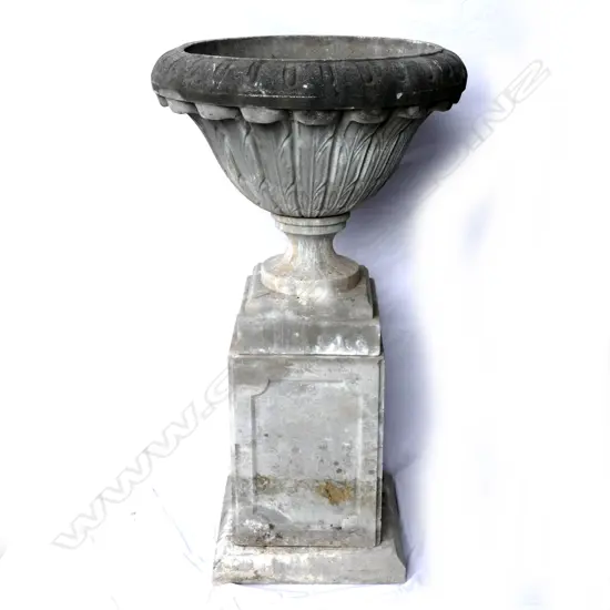 A large concrete garden urn