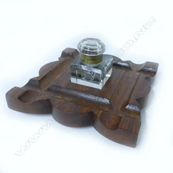 An Edwardian square oak desk tidy