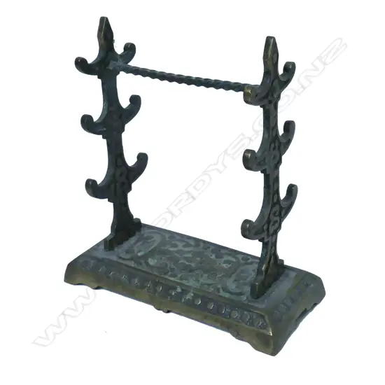 A brass six place dip pen stand