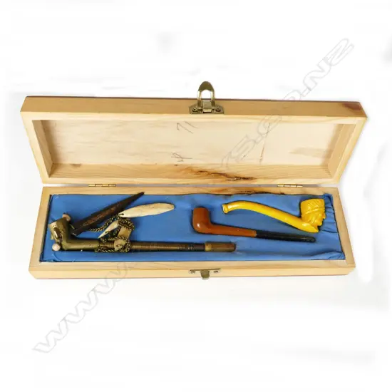 A boxed collection of miniature pipes