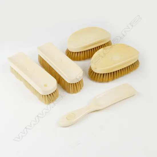A 1920s gent's ivory brush set