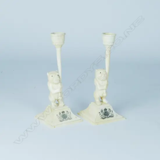 A pair of decorative bone candlesticks