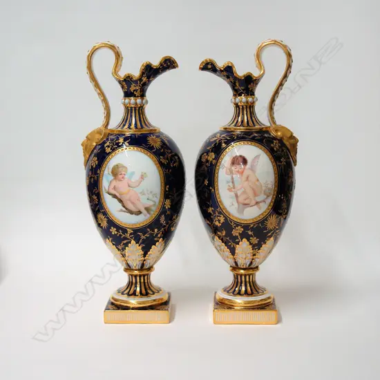 A pair of Mintons bone china ewers hand painted by Boullemier and Sutton