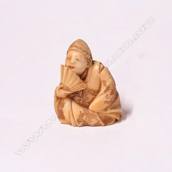 A Japanese Meiji period carved ivory netsuke