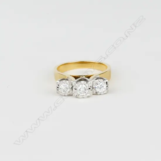 An 18ct gold and three stone diamond ring