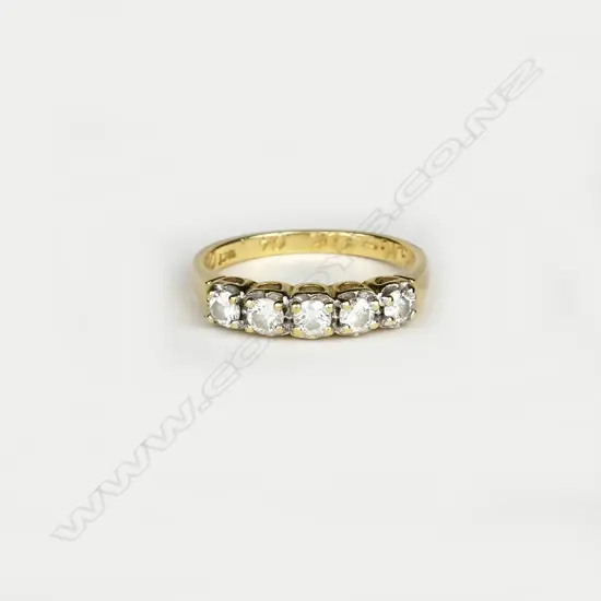 An 18ct. gold and five stone diamond ring