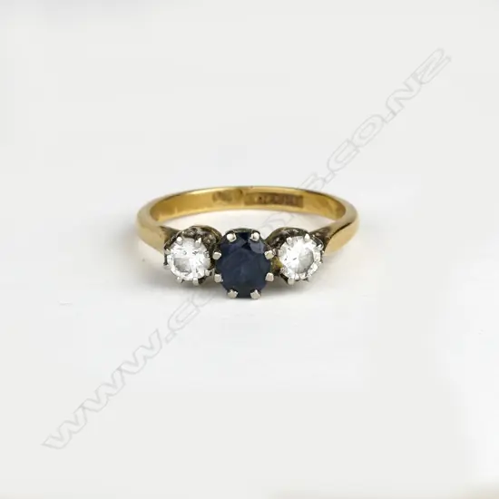 An 18ct. gold sapphire and diamond ring