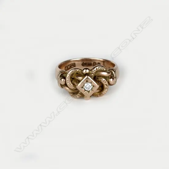 A 9ct. rose gold and diamond ring