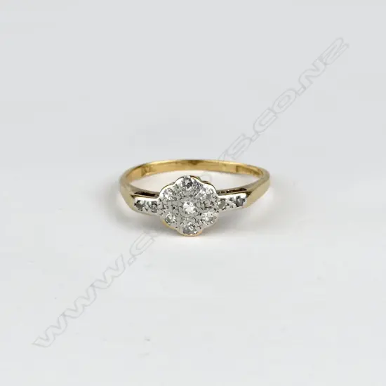 An estate 9ct. gold and diamond cluster ring