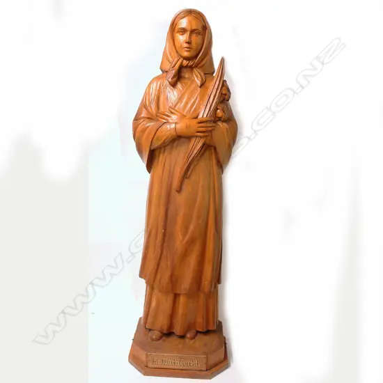 A large finely carved fruitwood religious statue of 'St. Maria Goretti'