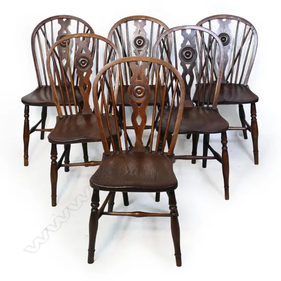 A set of six Victorian oak and elm country wheel back Windsor chairs,