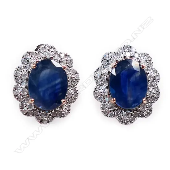 A pair of 14ct rose gold sapphire and diamond halo earrings,