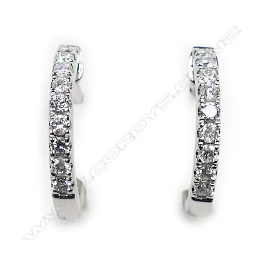 A pair of18ct white gold and diamond huggie earrings,